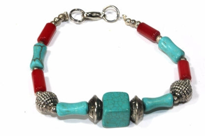 Mozambique tribal resin bracelet by Silver Hestia featuring colorful, handcrafted tribal resin beads on a black cord.