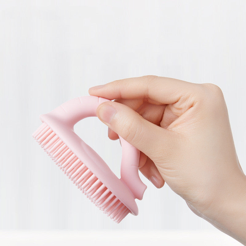 Maroon Asteria baby shower silicone brush for bathing and dandruff removal, soft scrubbing tool for gentle scalp cleaning.