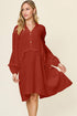 Carmine Juneberry double take full size textured dress with half button front and ruffle trim, showcasing a stylish, feminine design.