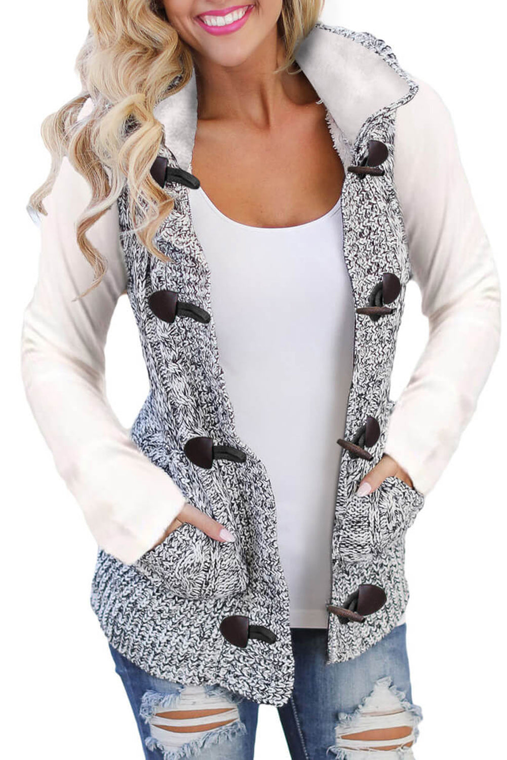 Multicolour cable knit hooded sweater vest from Harlequin Daisy, featuring a cozy, textured knit design with a hood and vibrant colors.