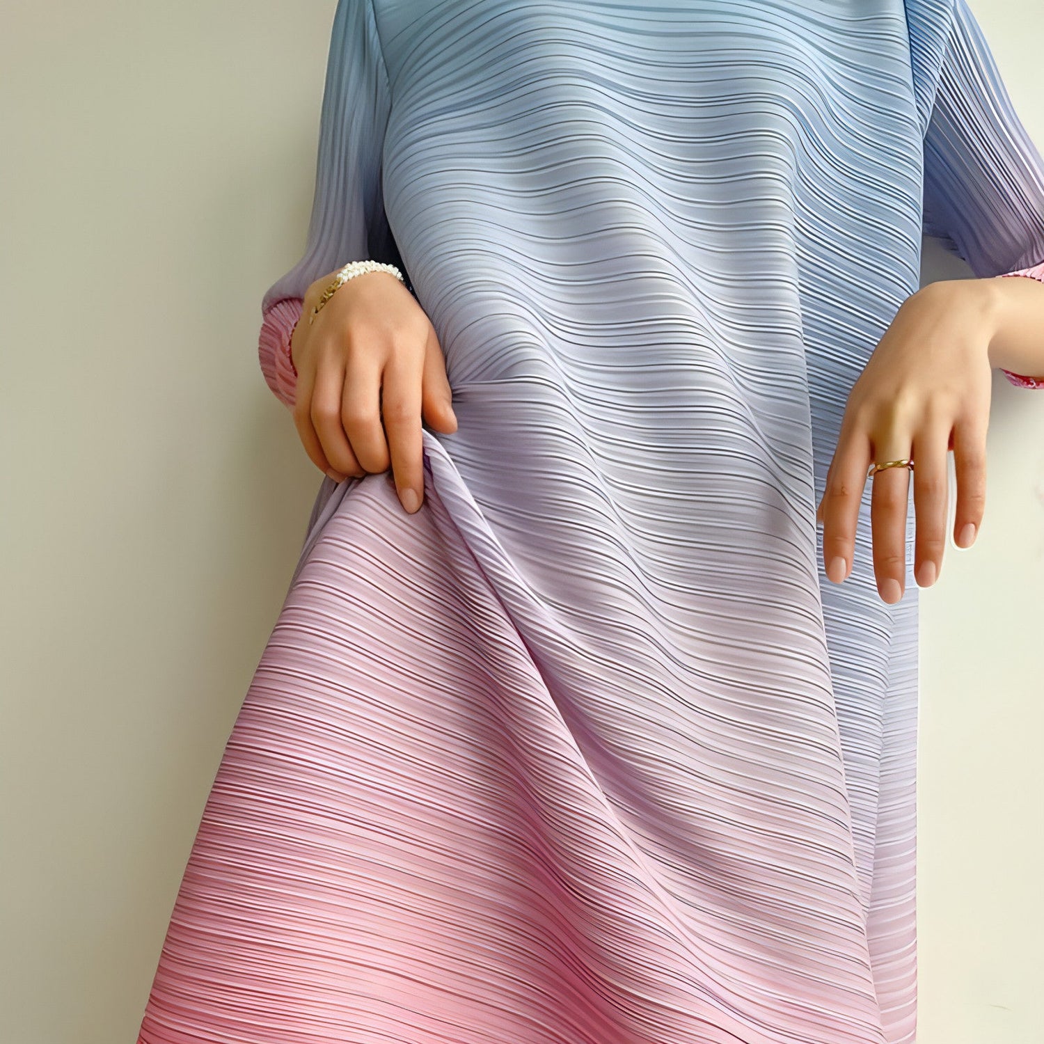 Plus size pleated dress for women by Carmine Juneberry, featuring a flowing design and elegant pleats.