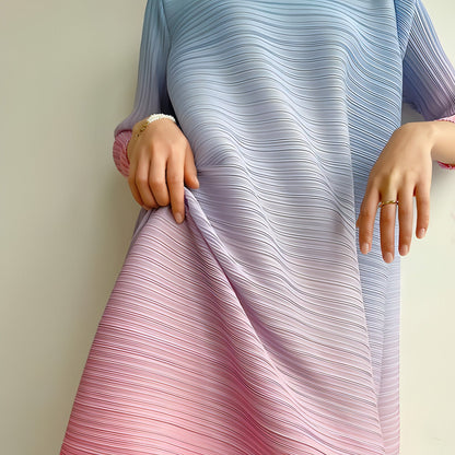 Plus size pleated dress for women by Carmine Juneberry, featuring a flowing design and elegant pleats.