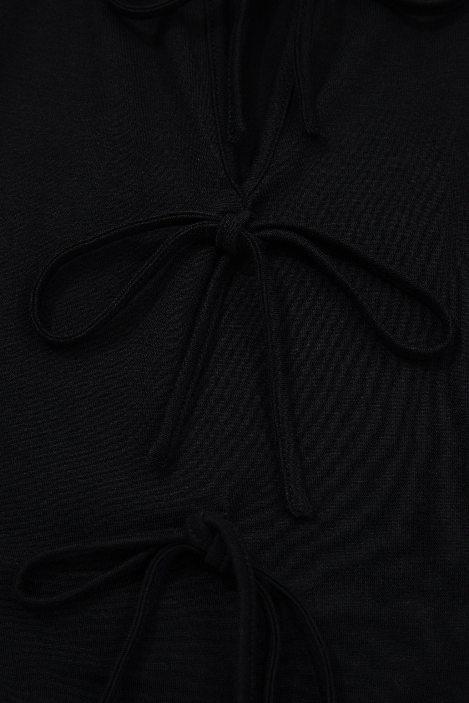 Plus size solid bow-tie peplum tank top for women by Byzantium Bay, featuring a fitted silhouette and stylish design.
