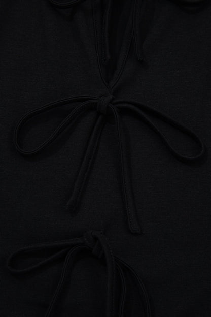 Plus size solid bow-tie peplum tank top for women by Byzantium Bay, featuring a fitted silhouette and stylish design.