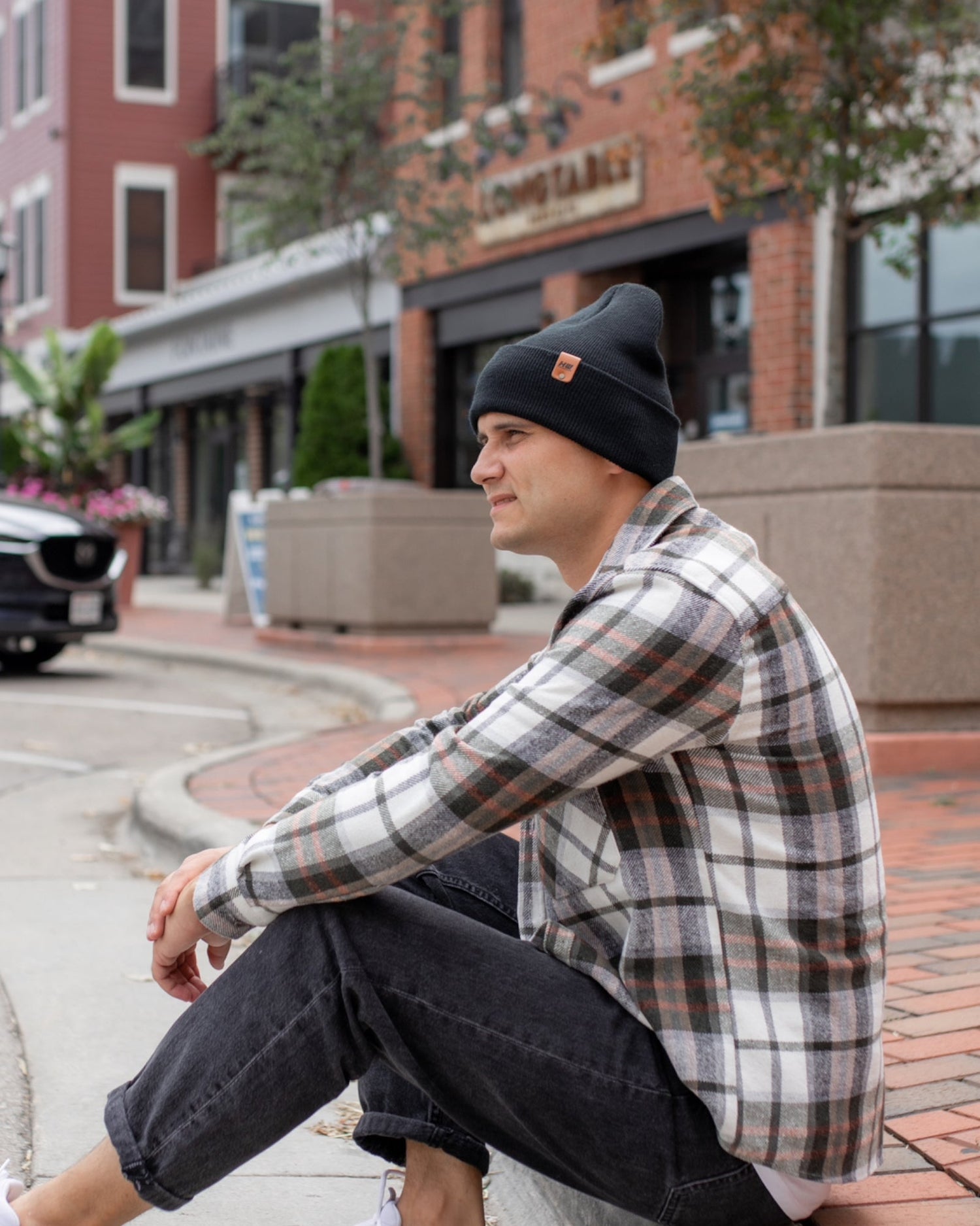 Azure Arrowwood HAAKWEAR knit cuffed beanie in Dune Beige, featuring a cozy, ribbed knit design perfect for cold weather.