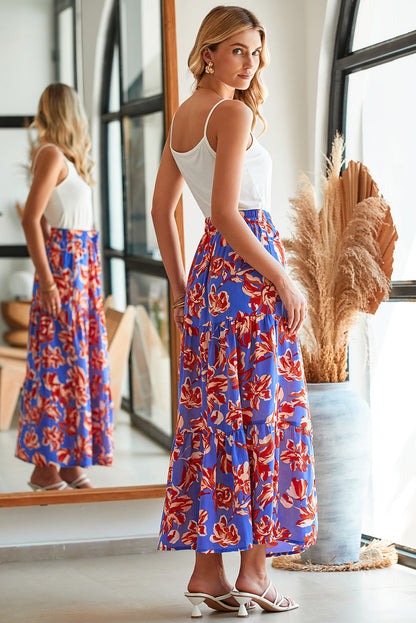 Byzantium Bay boho floral tiered side slit maxi skirt for women, featuring a flowing design with colorful floral patterns and a side slit.