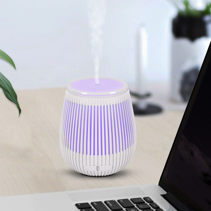 Colorful USB aromatherapy humidifier by Pink Lucky, featuring a sleek fragrance lamp design with vibrant lights and mist output.