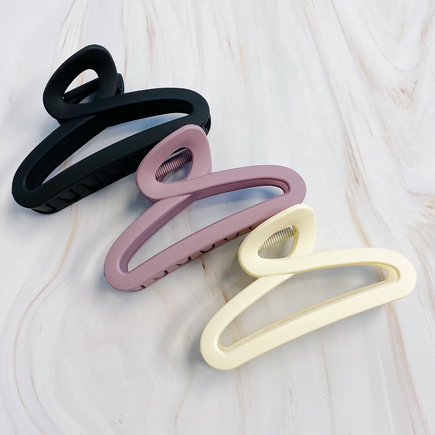 Set of three Fuchsia Hercules hair claw clips with decorative jewelry-style design for stylish hair holding.