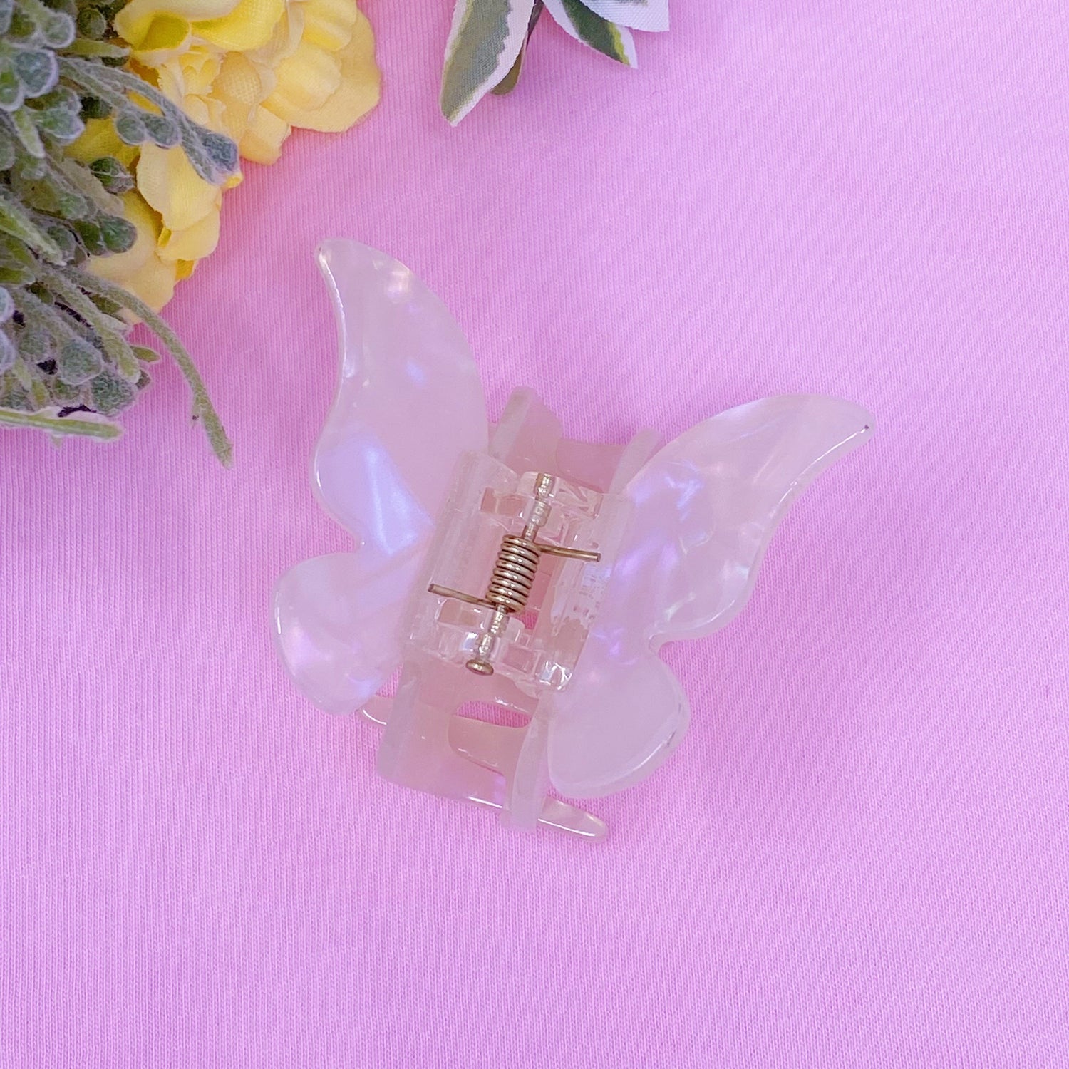 Fuchsia Hercules butterfly hair claw with metallic finish, decorative jewelry accessory for styling hair and adding a touch of elegance.