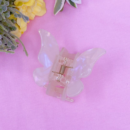 Fuchsia Hercules butterfly hair claw with metallic finish, decorative jewelry accessory for styling hair and adding a touch of elegance.