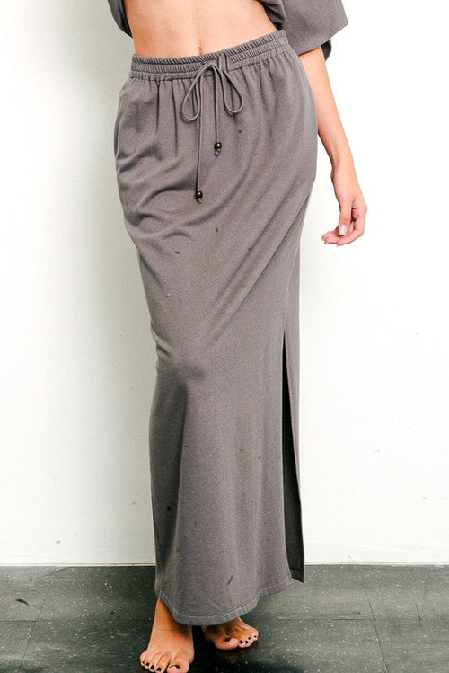 Brushed organic hemp side slit maxi skirt by Jade Icarus featuring a flowy silhouette and natural earthy tones.