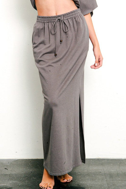 Brushed organic hemp side slit maxi skirt by Jade Icarus featuring a flowy silhouette and natural earthy tones.