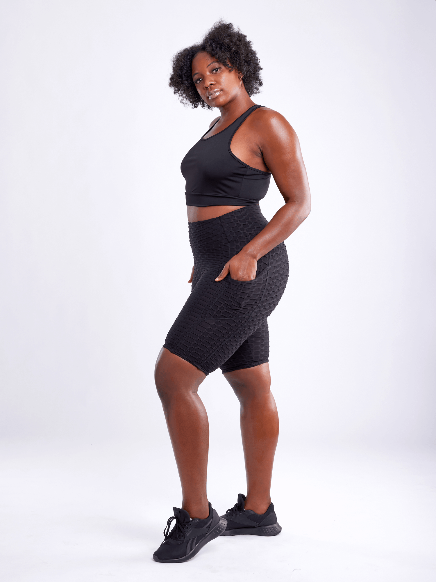 Black Lavender JupiterGear high-waisted scrunch yoga shorts with hip pockets, featuring a comfortable activewear fit.