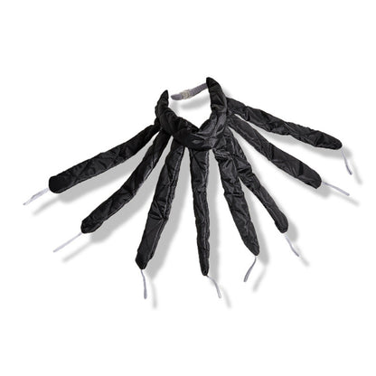 Maroon Asteria heatless hair curlers with ribbon headband for gentle, no-heat curling of hair on a salon surface.