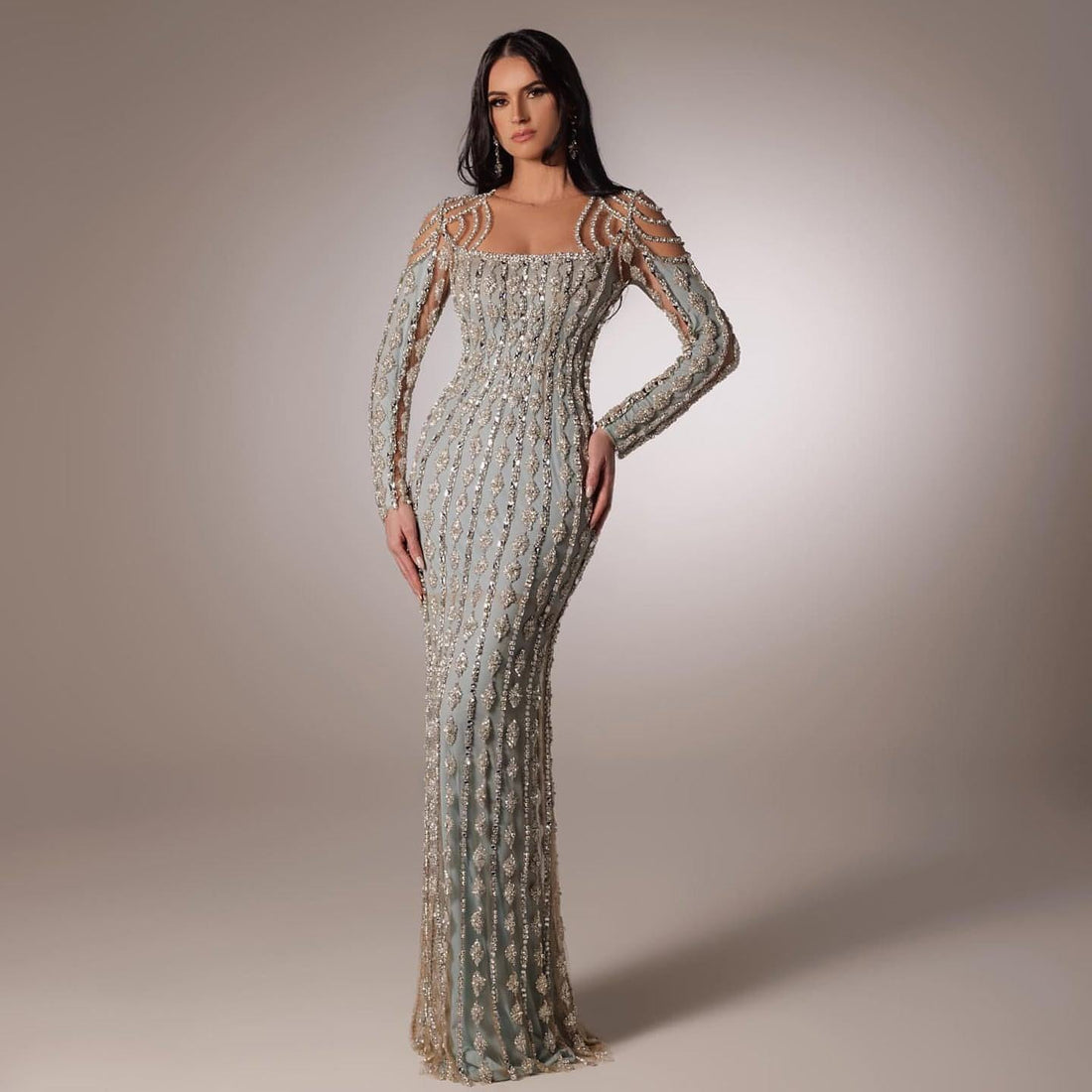 Carmine Juneberry long sleeve slim fishtail dress displayed on a mannequin, showcasing its elegant fit and flowing silhouette.