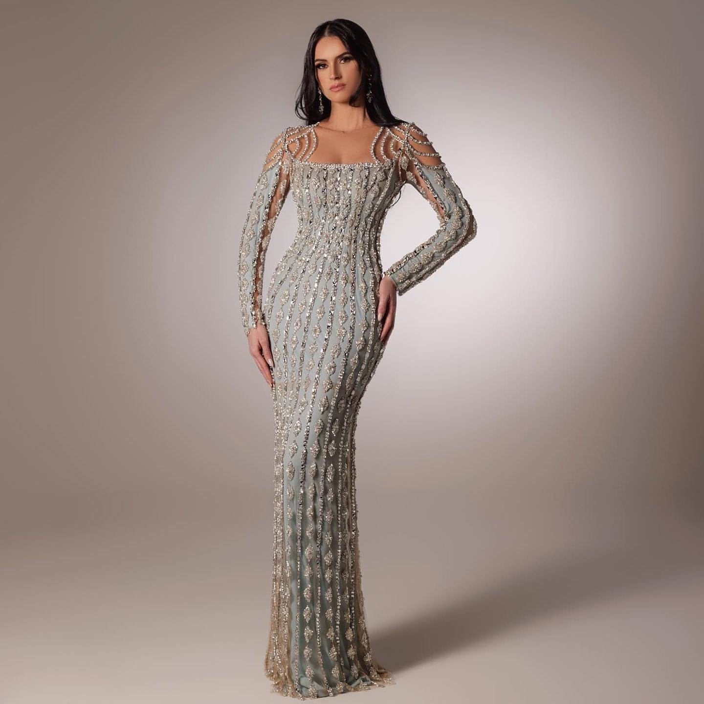 Carmine Juneberry long sleeve slim fishtail dress displayed on a mannequin, showcasing its elegant fit and flowing silhouette.