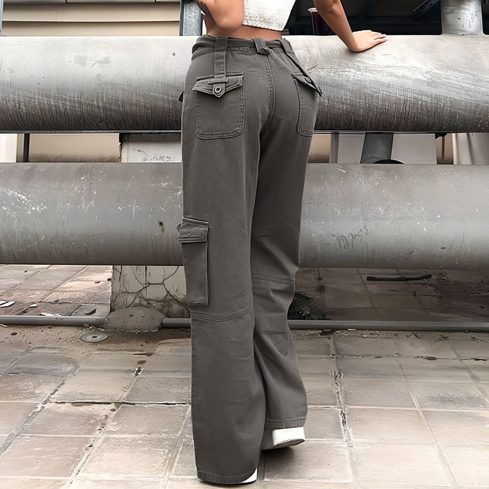 Carmine Juneberry vintage jeans with multiple pockets, casual workwear style for women, showcasing the belt and distressed denim details.