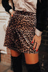Leopard print tiered patchwork mini skirt by Byzantium Bay showing its stylish layered design and vibrant animal print fabric.