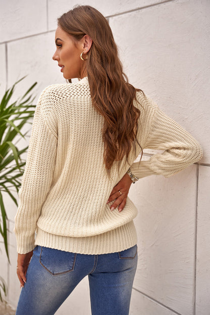 Beige wrap V-neck sweater with side tie from Harlequin Daisy, cozy knit top with relaxed fit, perfect for casual wear.