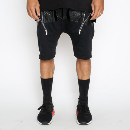 Leather front moto shorts by Lime Milo with sleek design and stitched detailing, perfect for stylish casual wear.