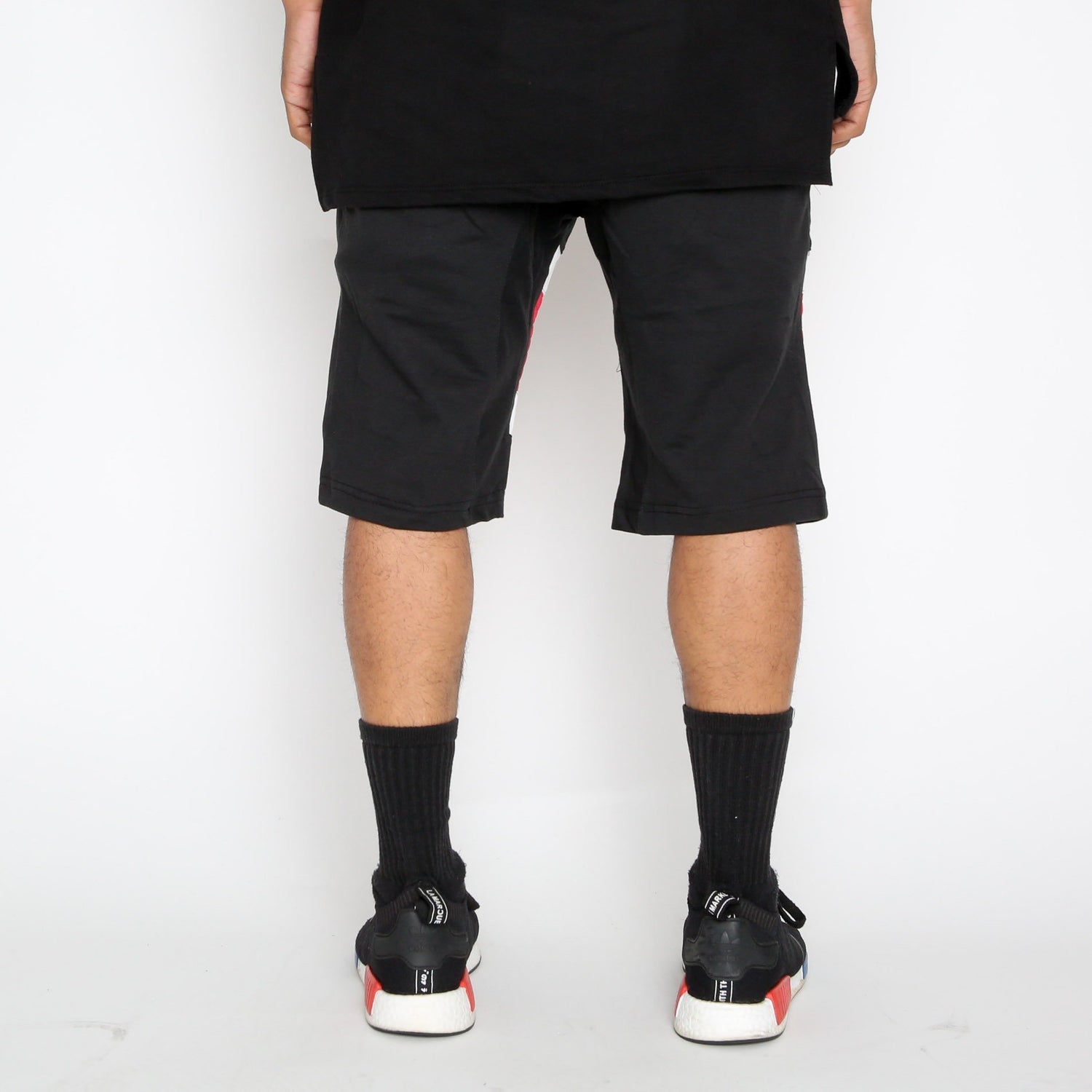 Red Stripe Moto Shorts by Lime Milo featuring a stylish design and casual fit, displayed on a white background.