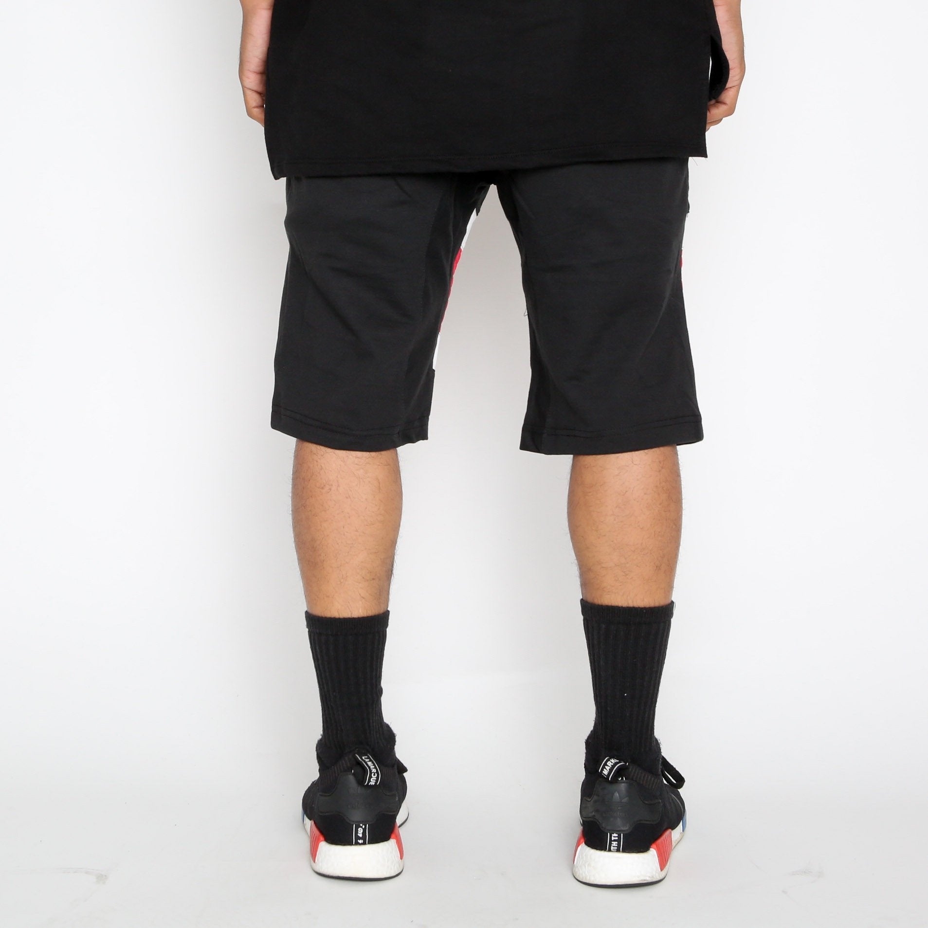 Red Stripe Moto Shorts by Lime Milo featuring a stylish design and casual fit, displayed on a white background.