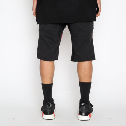 Red Stripe Moto Shorts by Lime Milo featuring a stylish design and casual fit, displayed on a white background.