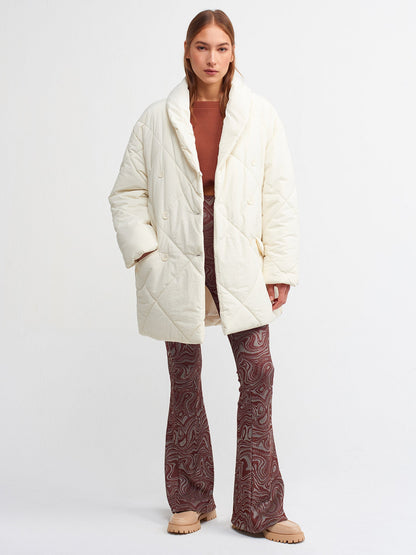Women’s quilted coat by Ruby Dionysus in ekru color, featuring a cozy, padded design and stylish fit for cold weather.