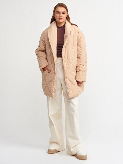 Beige quilted coat for women by Ruby Dionysus, featuring a warm, padded design and stylish collar detail.