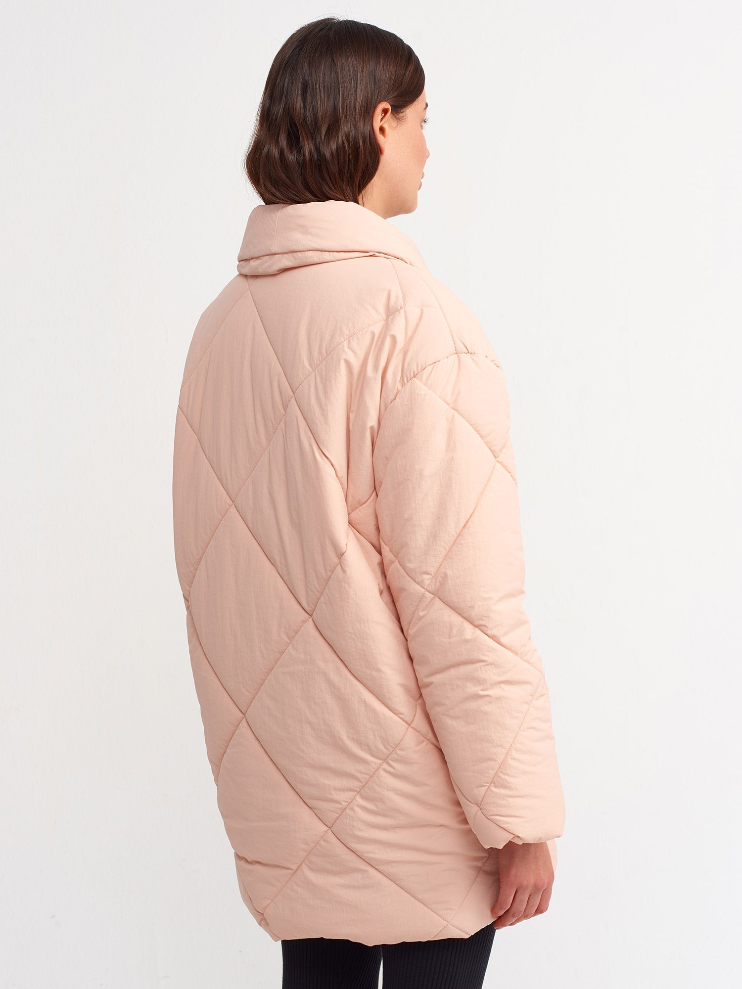 Pink quilted coat for women by Ruby Dionysus, featuring a stylish padded design and cozy fit.