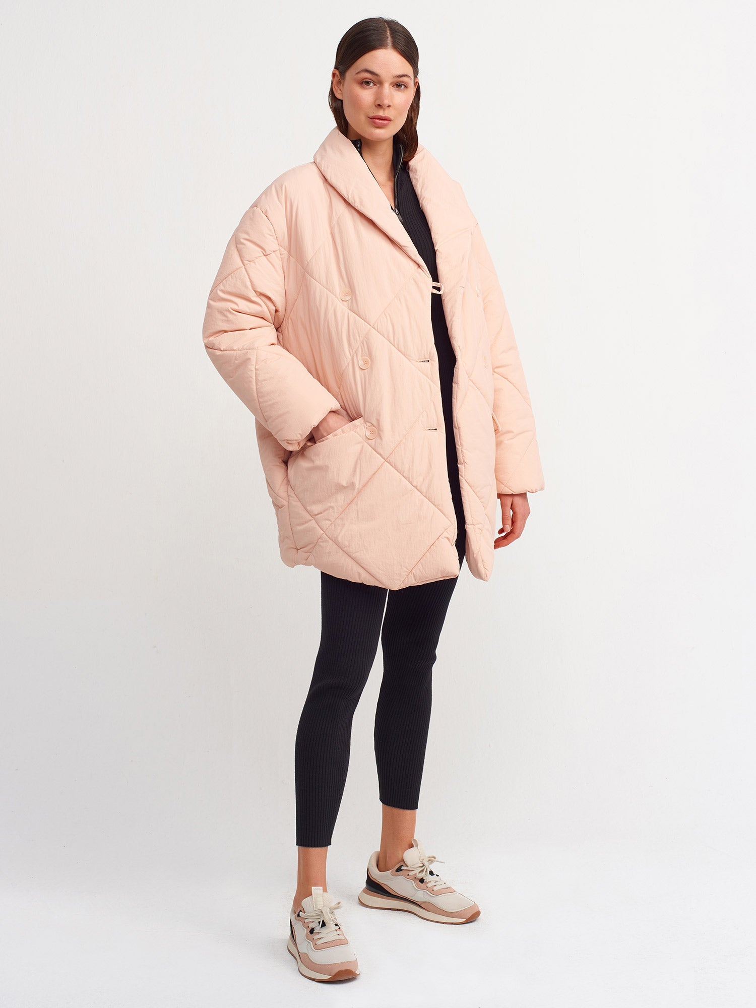 Light pink quilted coat for women by Ruby Dionysus, featuring a stylish, padded design and comfortable fit.