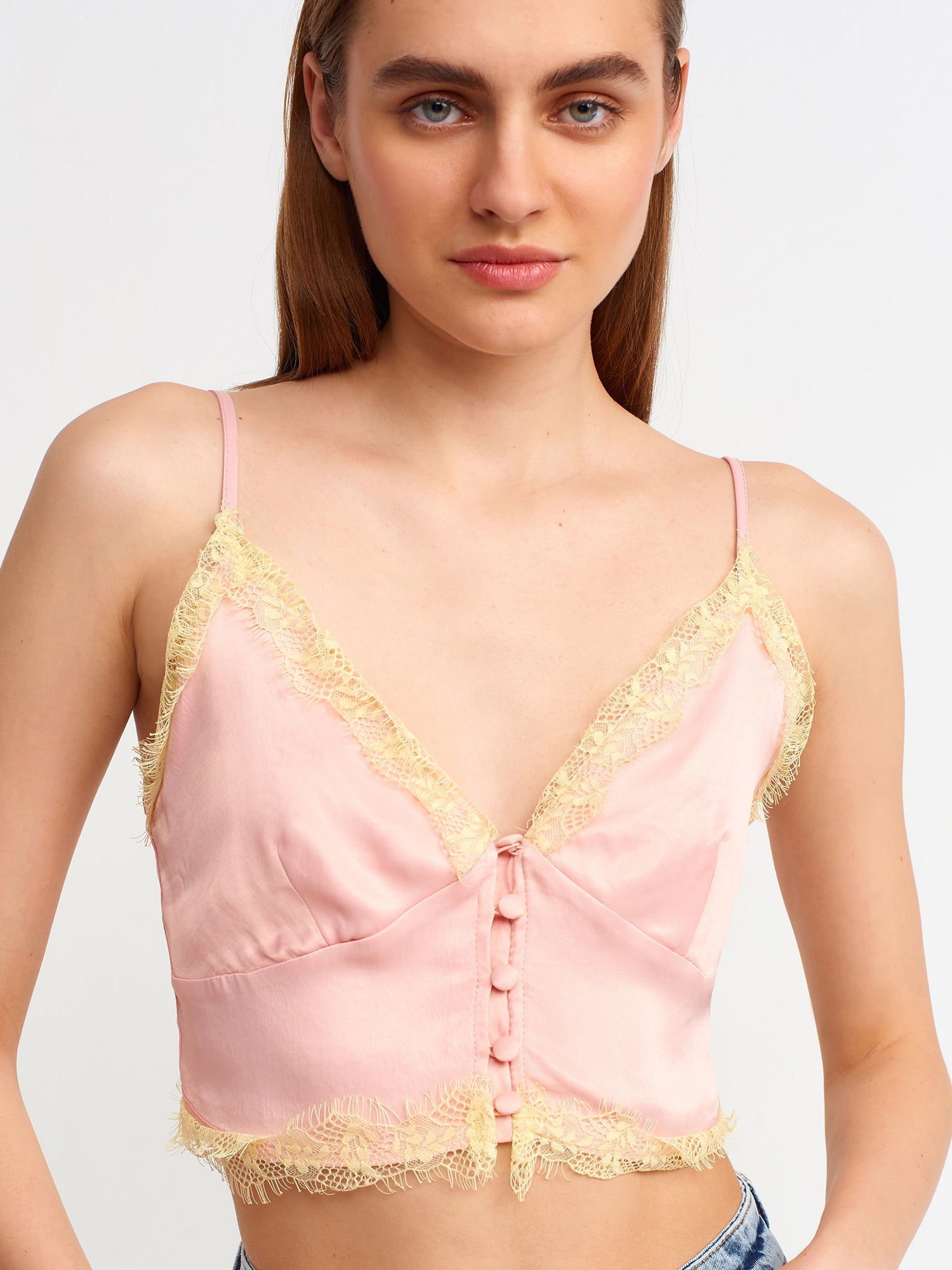 Pink lace detailed crop top for women by Ruby Dionysus, featuring intricate lace design and fitted style.