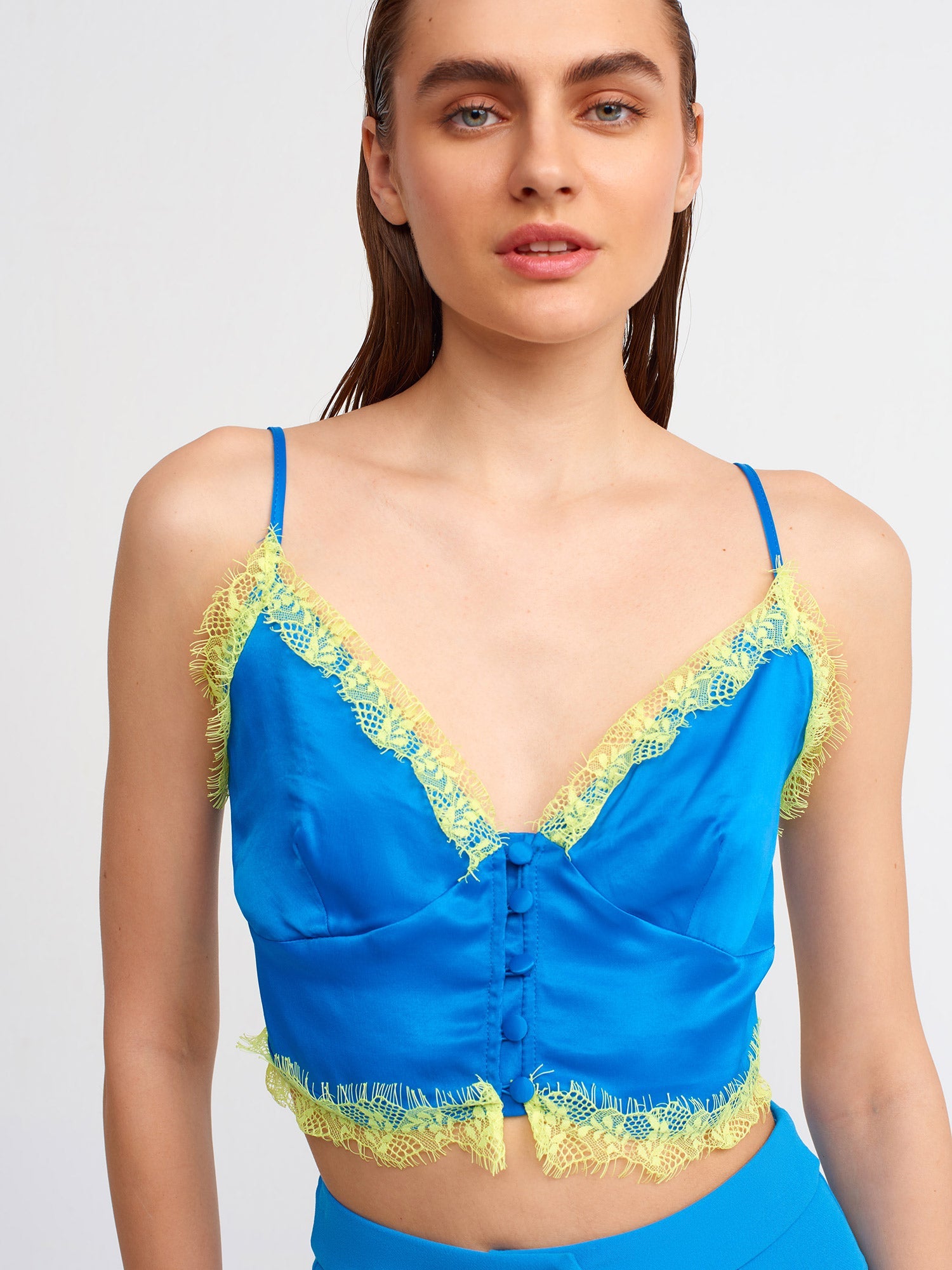 Lace detailed crop top for women by Ruby Dionysus, featuring intricate lace design and fitted style.