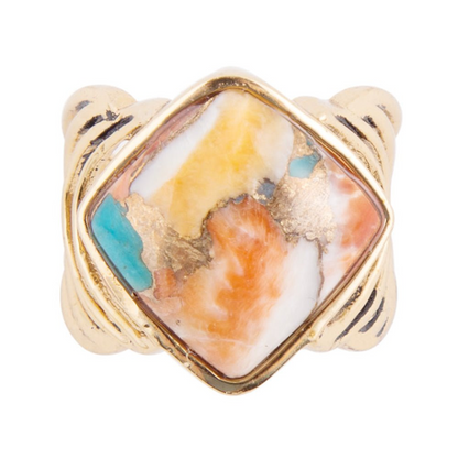 Blue turquoise and orange spiny oyster matrix gold ring featuring intricate jewelry design with vibrant colors and detailed craftsmanship.