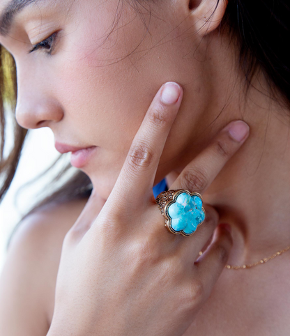 Blue turquoise flower gold ring from Start2Finish, featuring a vibrant turquoise flower design on a gold band.