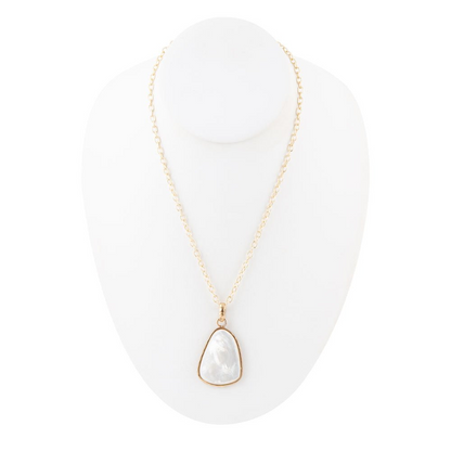 White mother of pearl teardrop pendant necklace with gold chain, elegant jewelry piece featuring a polished pearl drop.