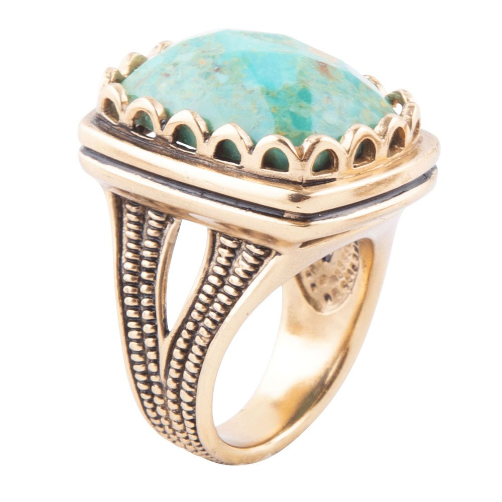Blue turquoise and golden cocktail ring from Start2Finish jewelry, featuring a vibrant turquoise stone and intricate gold setting.