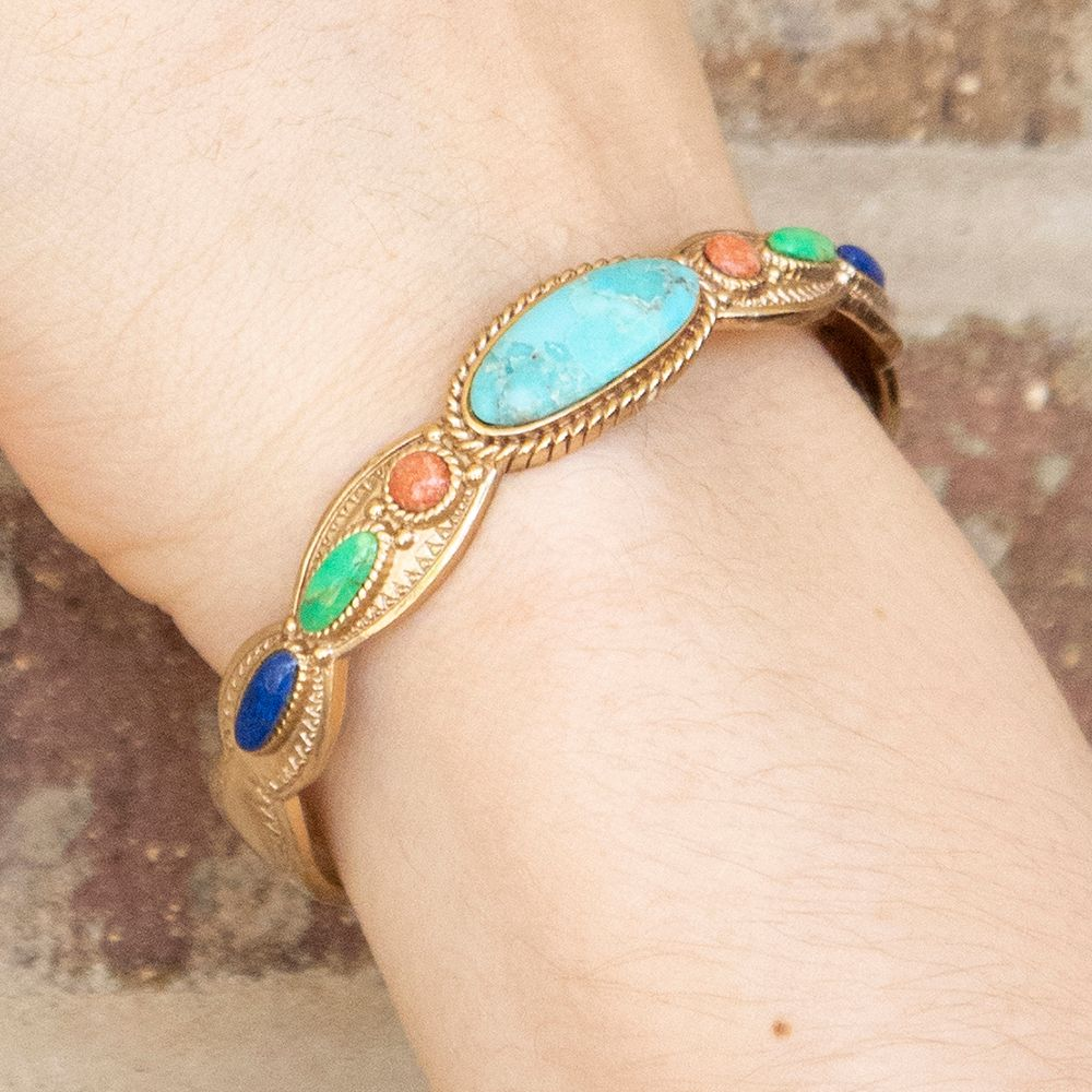 Colorful golden cuff bracelet with concho designs from Start2Finish jewelry, featuring vibrant accents and intricate metalwork.