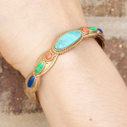 Colorful golden cuff bracelet with concho designs from Start2Finish jewelry, featuring vibrant accents and intricate metalwork.