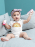Baby bodysuit with bright sun and rays print from Start2Finish, featuring colorful sun design and soft fabric for infants.