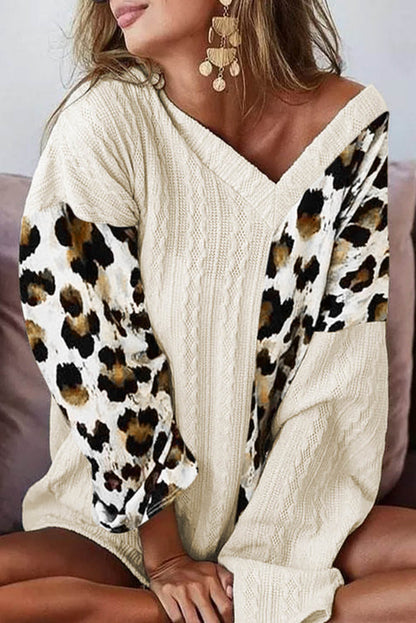Beige asymmetric leopard patchwork wide sleeve V-neck sweater by Carmine Juneberry, featuring bold animal print and stylish design.
