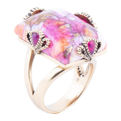 Prismatic pink spiny oyster matrix statement ring featuring intricate jewelry design with vibrant pink hues and textured details.