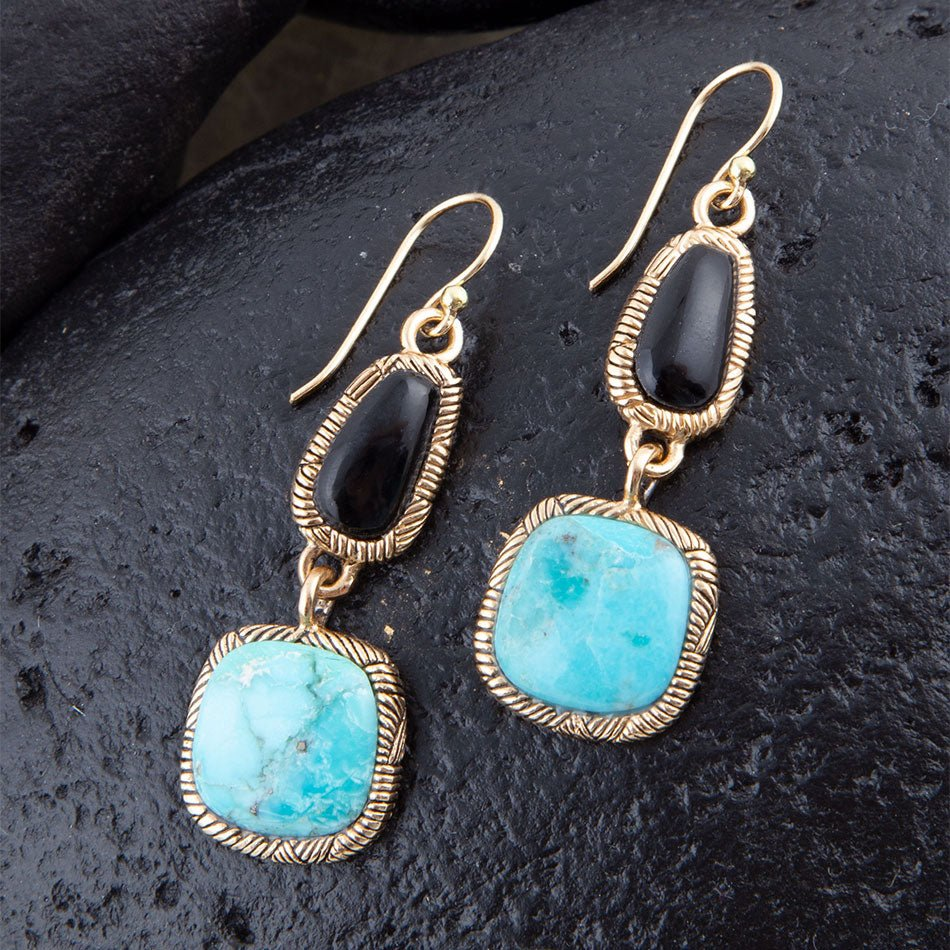 Black Onyx and Blue turquoise drop earrings in golden bronze jewelry with intricate detailing and elegant design.