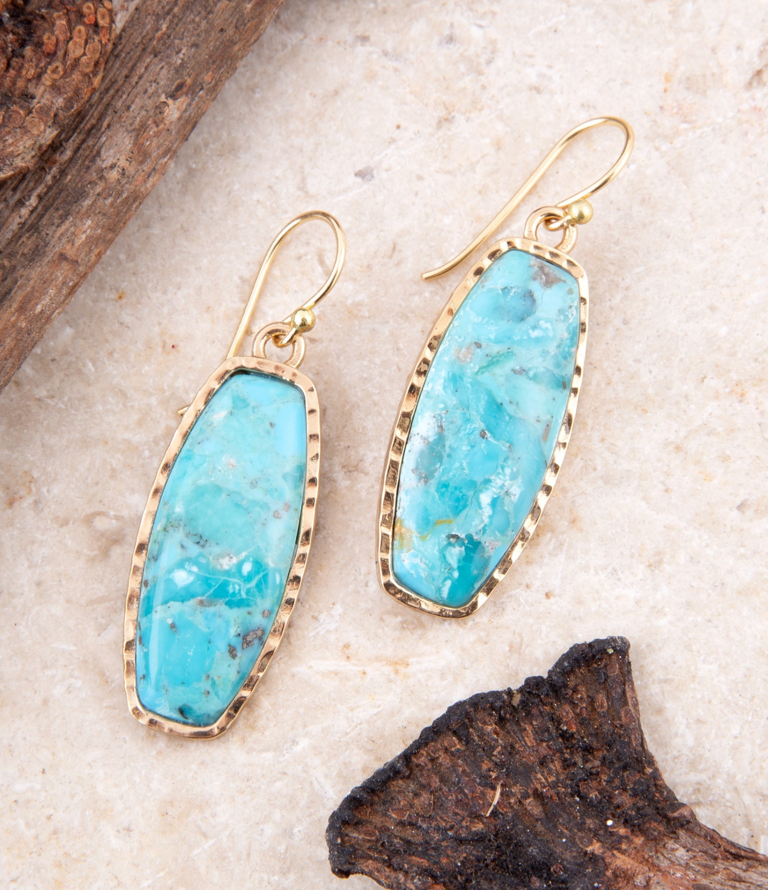Start2Finish Odyssey long turquoise and gold statement earrings with intricate design, vibrant blue and golden hues, jewelry accessory