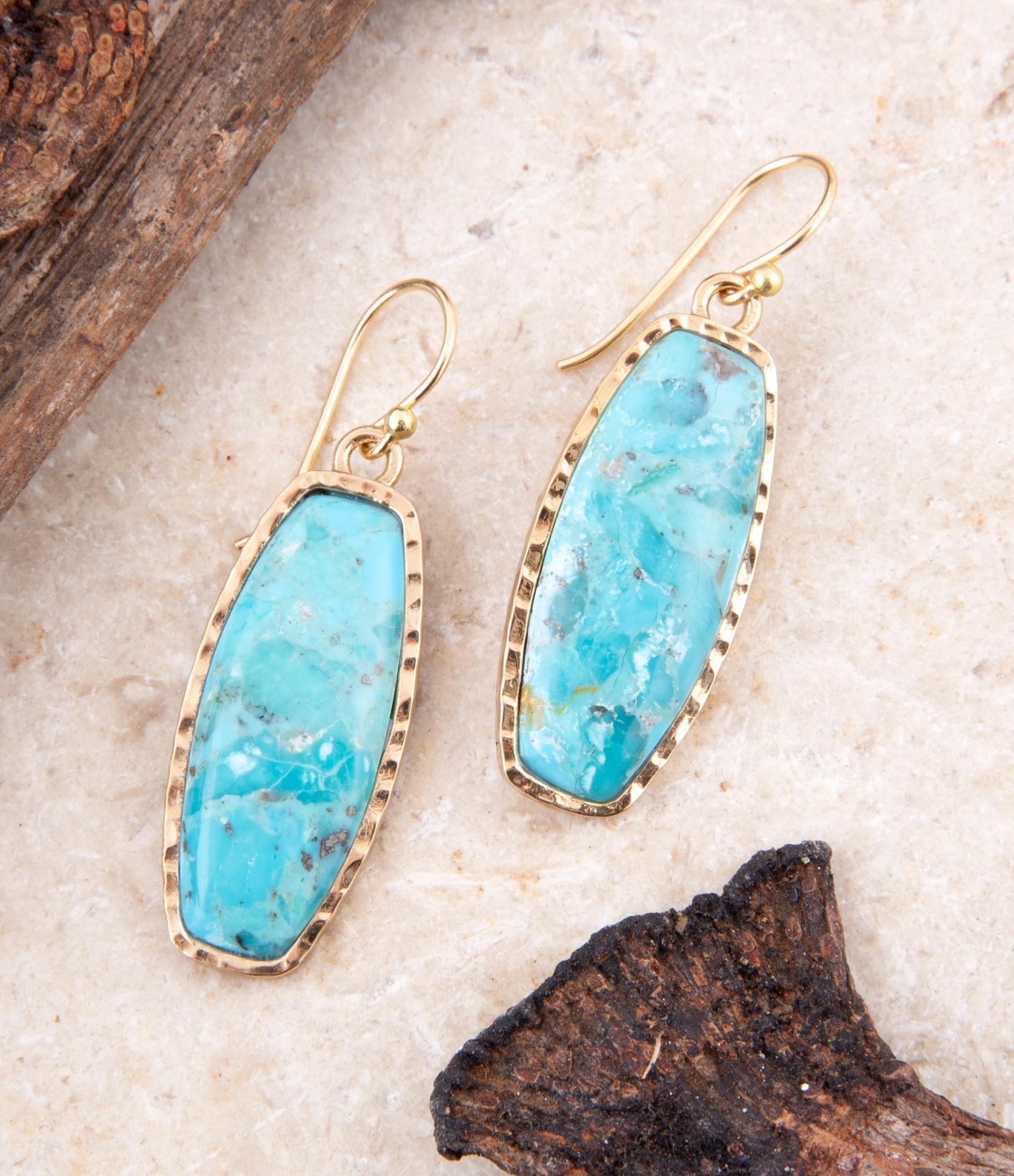 Start2Finish Odyssey long turquoise and gold statement earrings with intricate design, vibrant blue and golden hues, jewelry accessory