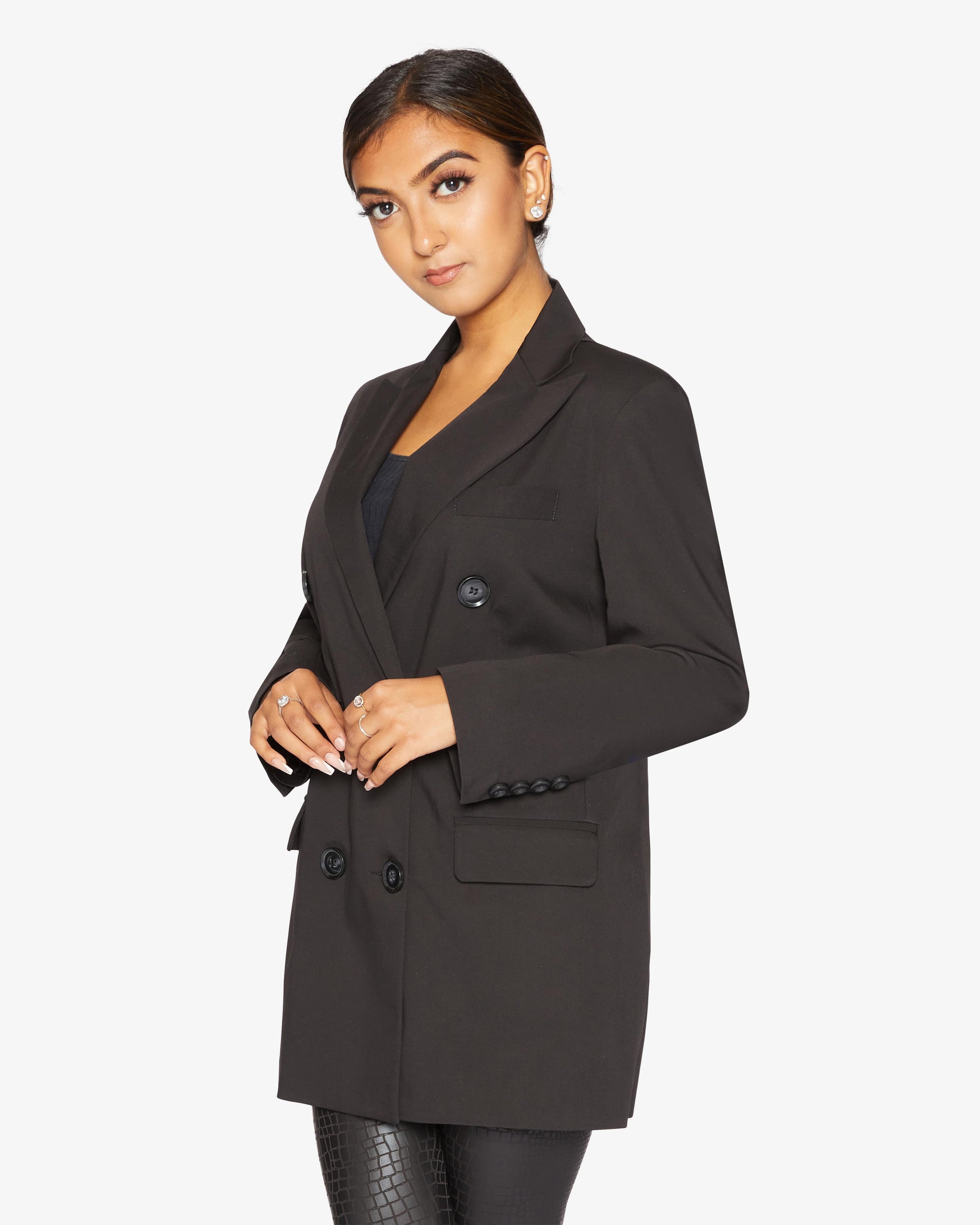Black Jenna Double Breasted Blazer by Rose Eleusis, tailored jacket with lapels and button details, displayed on a hanger.