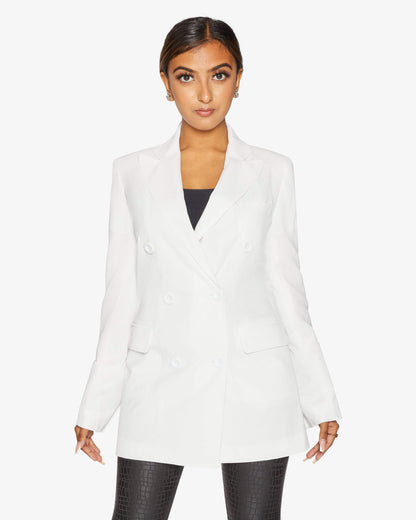 White Jenna double-breasted blazer by Rose Eleusis, tailored jacket with classic lapels and structured fit, shown on a model.