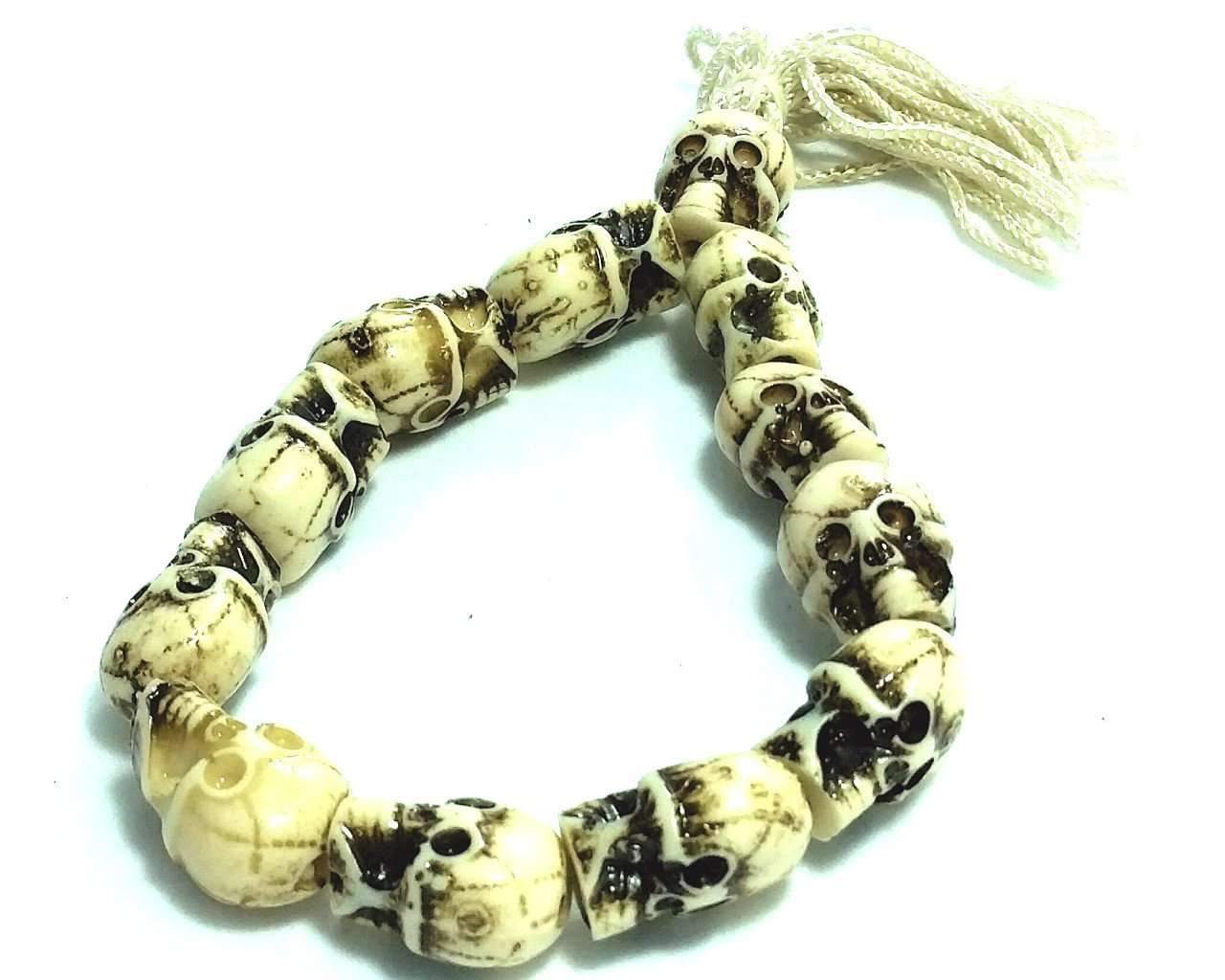 Silver Hestia tribal skull bracelet featuring metallic skull charms and intricate beadwork on a leather strap.