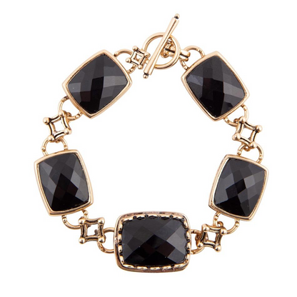 Black onyx golden link bracelet from Start2Finish jewelry, featuring glossy black onyx stones and gold-toned chain links.