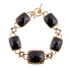 Black onyx golden link bracelet from Start2Finish jewelry, featuring glossy black onyx stones and gold-toned chain links.